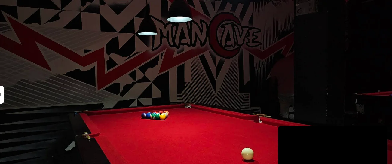 Red neon pool table room at Man Cave Taleigao