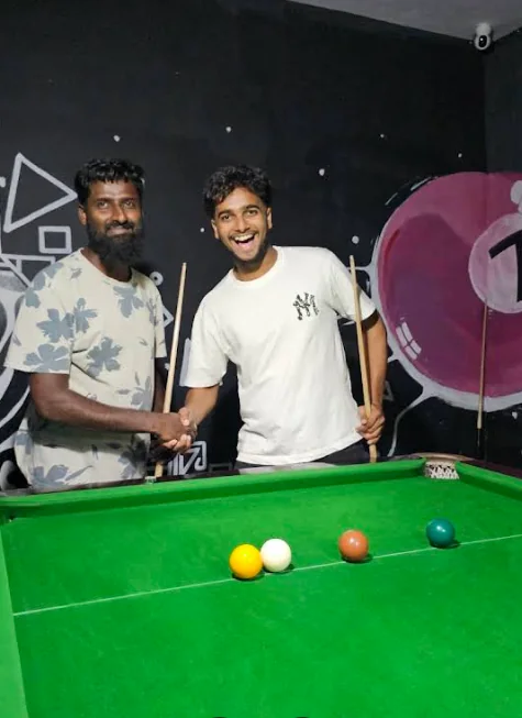 Friends at pool table